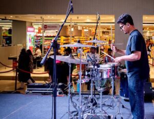 Live percussionist drummer performing at event in India 